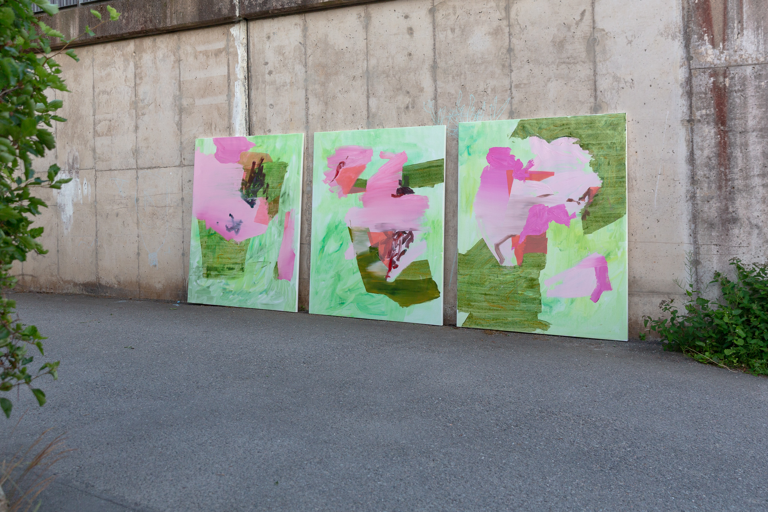 An abstract oil painting primarily in pink, but with many other interlaced colors